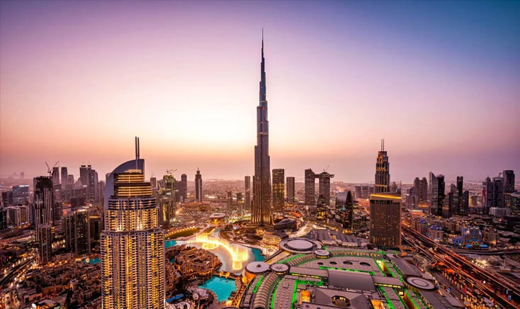 dubai-downtown-with-lights-on-during-sunset