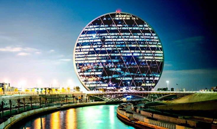 Aldar-hq-at-night-property-investment-in-abu-dhabi