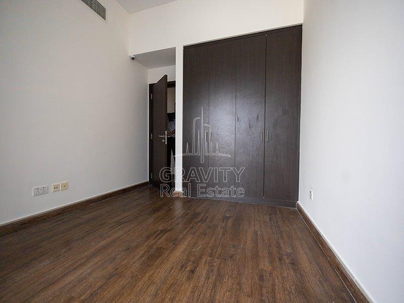 amazing-bedroom-with-built-in-wardrobe-woodedn-floor-in-a-3-bedroom-located -in-marina-bay-reem-island-apartments