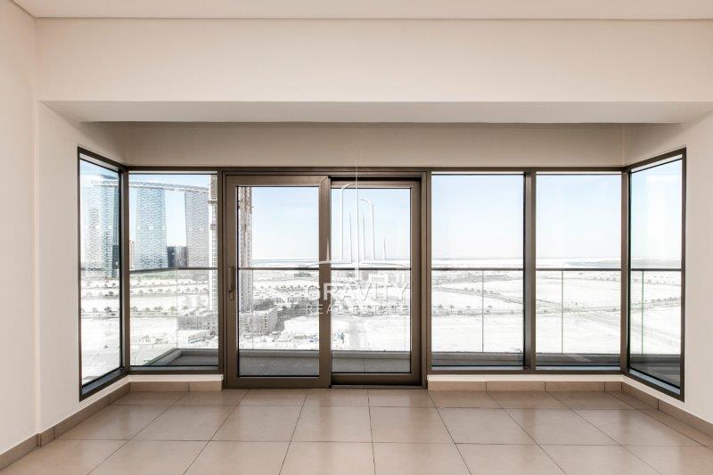 amazingly-wide-glass-wall-and-door-directed-to-balcony-in-a-2-BR-apartment-in-the-wave-tower-reem-island