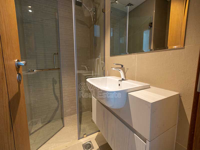 bathroom-with-shower-area-in-3-bedroom-apartment-in-julphar-residence-al-reem-island