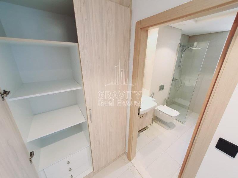 bathroom-with-storage-and-cabinets-in-a-2-bedroom-townhouse-in-bloom-garden-abu-dhabi-for-rent