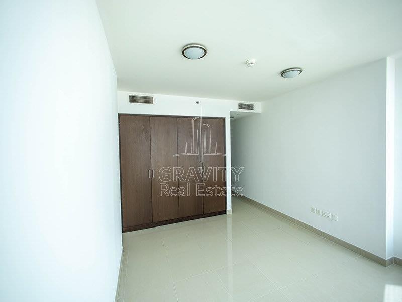 bedroom-with-built-in-brown-wardrobe-amazing-view-on-a-1-bedroom-apartment-in-sky-tower-al-reem-island-for-rent