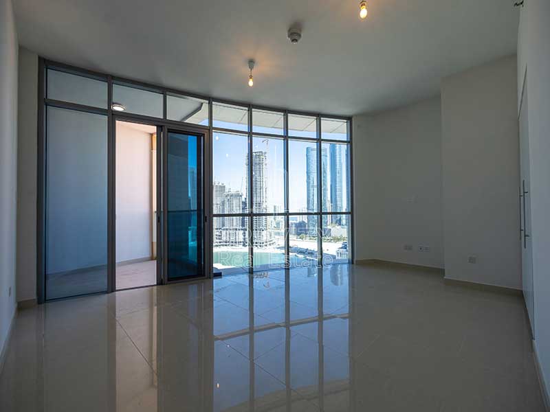 bedroom-with-floor-to-ceiling-windows-in-3-bedroom-apartment-in-julphar-residence-al-reem-island