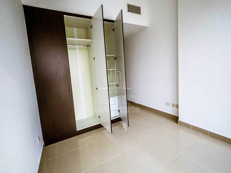 bedroom-with-large-dark-brown-cabinets-in-apartment-in-sigma-1-tower