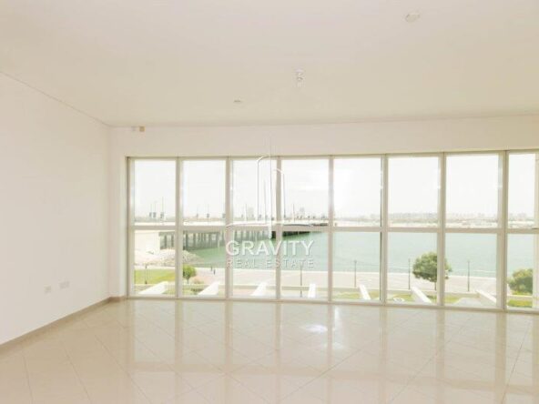 big-and-spacious-living-area-with-huge-window-panel-covering-the-onse-side-of-the-wall-in-rak-tower