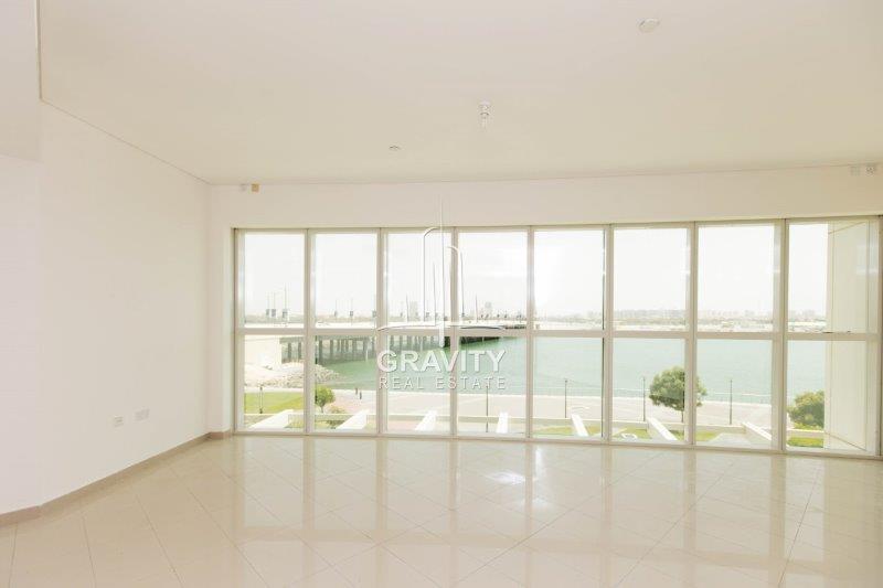 big-and-spacious-living-area-with-huge-window-panel-covering-the-onse-side-of-the-wall-in-rak-tower