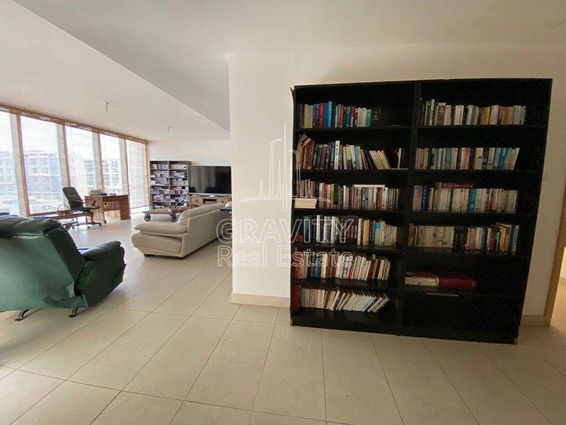 bookshelf-of-a-furnished-6-bedroom-villa-in-al-zeina-raha-beach