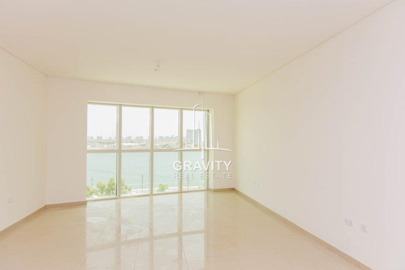 chraming-and-clean-living-room-area-with-nice-window-panel-overlooking-the-sea-view-rak-tower