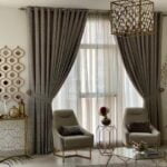 decored-wall-and-beautiful-curtains-with-nice-two-sofas-the-bridges-reem-island