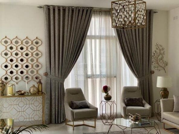 decored-wall-and-beautiful-curtains-with-nice-two-sofas-the-bridges-reem-island