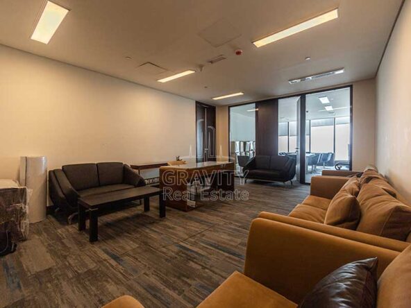 entrance-of-office-in-addax-tower-al-reem-island-with-multiple-couches-and-dark-wooden-flooring