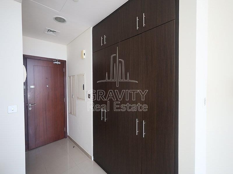 entrance-of-studio-apartment-in-hydra-c6-tower-with-dark-brown-wardrobes