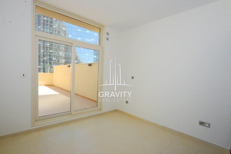 glass-door-directed-to-a-spacious-veranda-in-a-2-BR-apt-for-rent-in-mangrove-place-al-reem-island