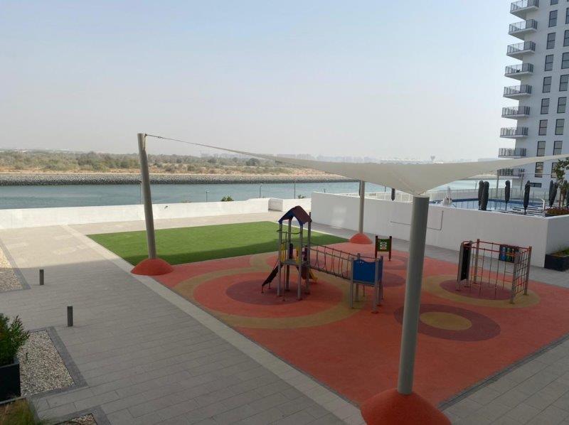 kids-play-area-wtih-near-the-canal-waters-edge-yas-island