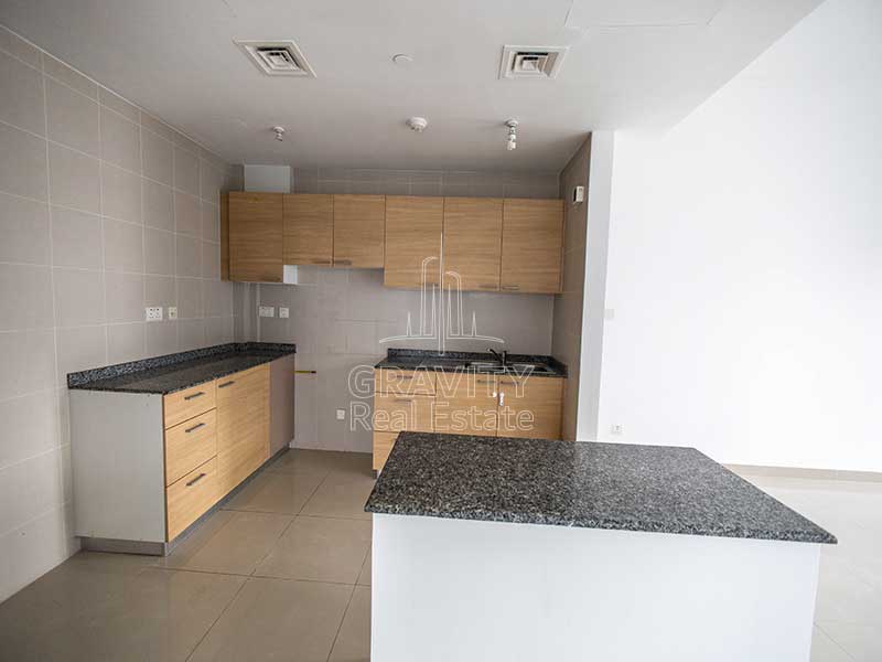 large-kitchen-with-large-light-brown-cabinets-in-2-bedroom-apartment-in-sigma-1-tower