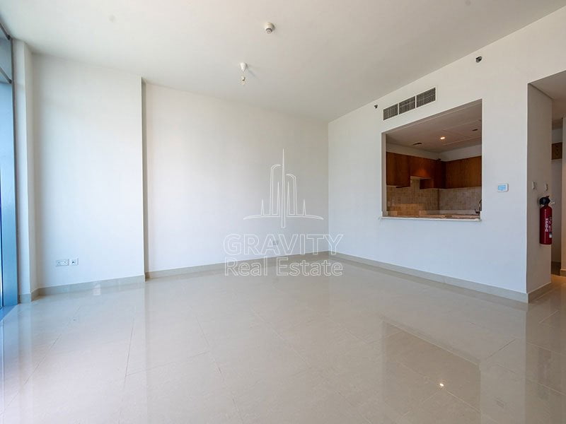 living-room-with-spacious-open-kitchen-in-stunning-2-bedroom-apartment-in-julphar-residence-tower