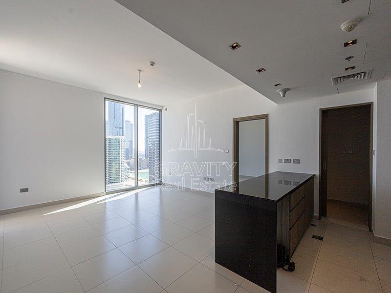 livingroom-w-open-kitchen-in-meera-shams-tower-2-bedroom-apt-for-sale