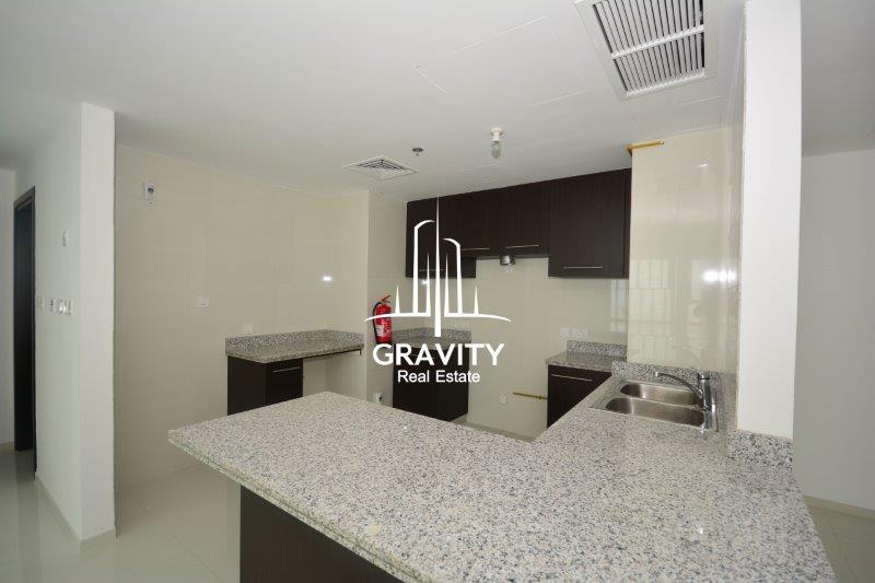 modern-open-kitchen-w-marbled-countertop-cabinets-and-cupboards-in-a-2-bedroom-apartment-in-horizon-towers-A-for-sale