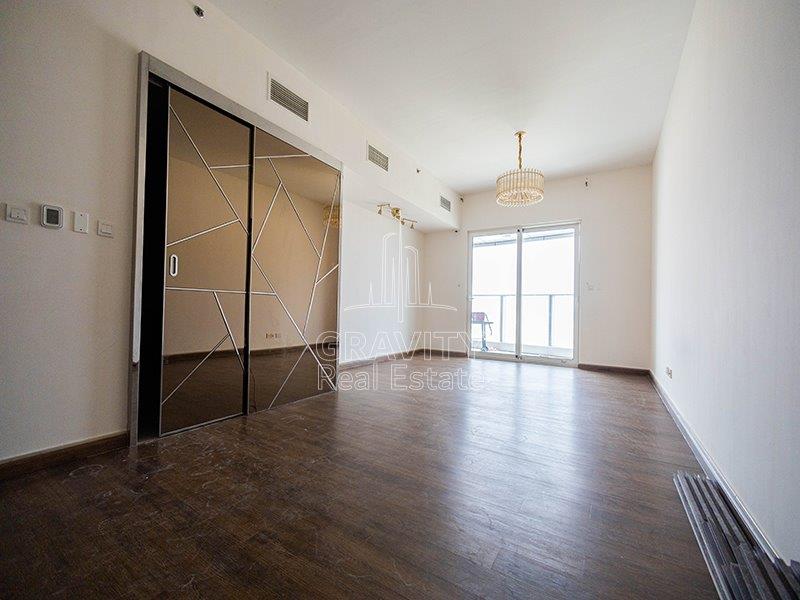 neat-living-room-w-wooden-floor--in-a-3-bedroom-located -in-marina-bay-reem-island-apartments