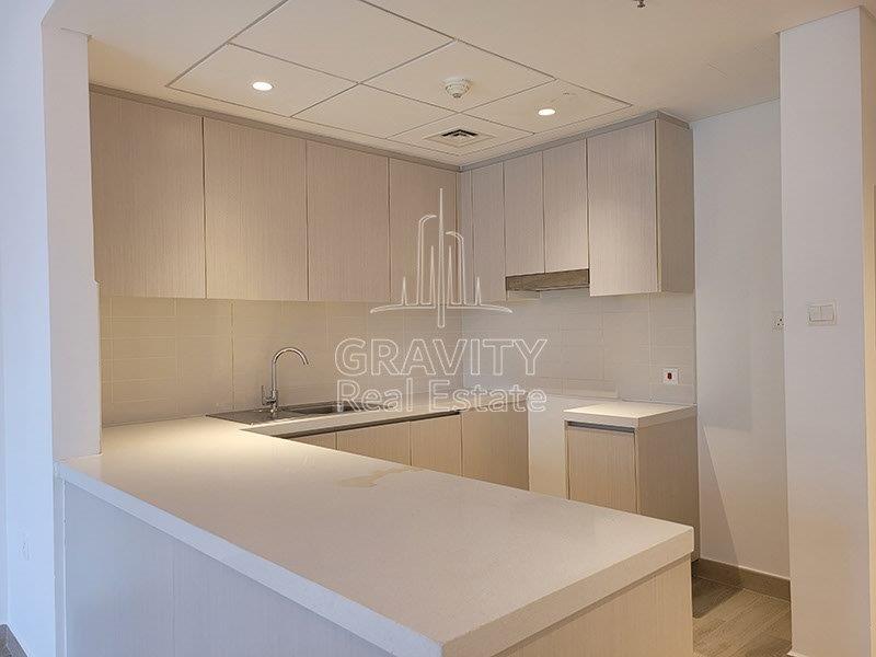 neat-open-kitchen-in-a-2-bedroom-waters-edge-apartment-for-sale