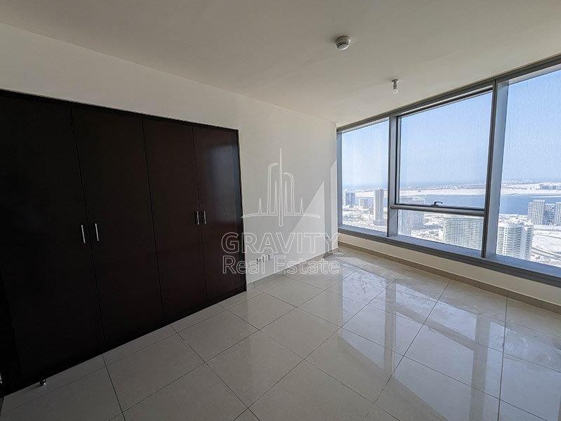 nice-and-spacious-living-room-with-built-in-wardrobe-and-glass-panel-overlooking-the-nice-view-from-sun-towers