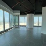 office-in-addax-tower-reem-island-with-dark-tiles-and-large-white-pillar