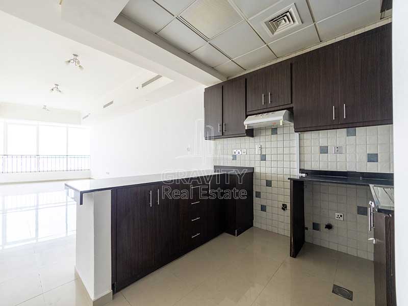 open-kitchen-with-dark-brown-cabinets-in-2-bedroom-apartment-in-hydra-avenue-towers