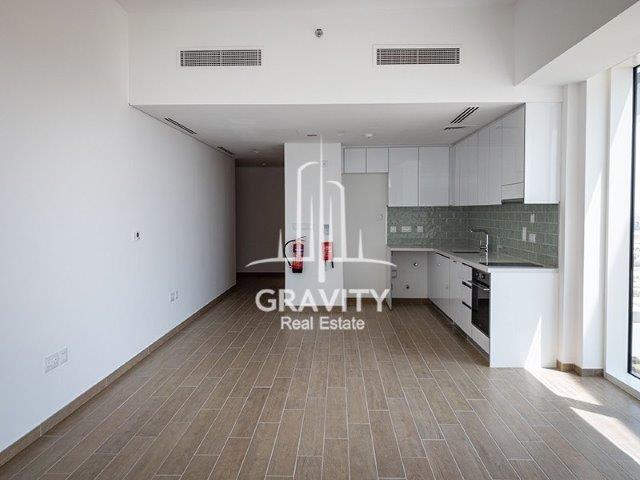 open-kitchen-with-white-walls-and-white-cupboards-surrounding-the-wall-two-ac-air-vents-mayan-abu-dhabi