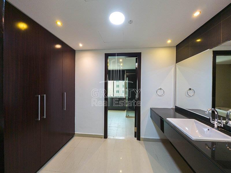 quiet-spacious-washroom-with-a-big-sink-and-attached-mirror-plus-built-in-wardrobes-at-back-mag-5-reem-island