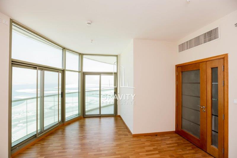 spacious-curved-living-room-area-with-the-entrace-to-the-balcony--in-beach-tower-reem-island