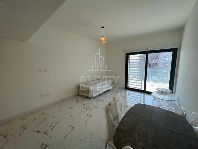 spacious-living-hall-area-with-marble-tiling-in-2-bedroom-apartment-in-al-raha-lofts-2