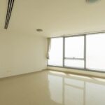 spacious-living-room-of-1-bedroom-apartment-in-sky-tower-al-reem