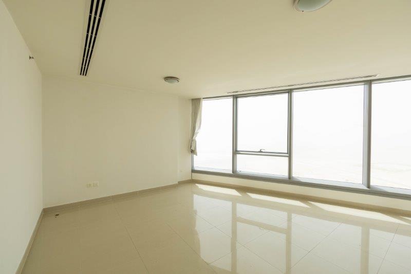 spacious-living-room-of-1-bedroom-apartment-in-sky-tower-al-reem