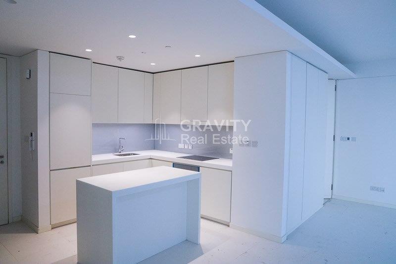 spacious-open-kitchen-area-with-nicely-fitted-white-cupboards-and-wardrobes-with-bright-lighting-in-rdk-towers