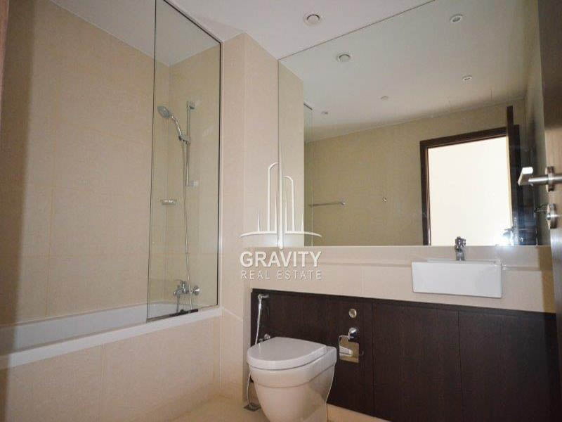 squeaky-clean-washroom-with-covered-shower-and-the-bath-tub-together-in-al-zeina-abu-dhabi