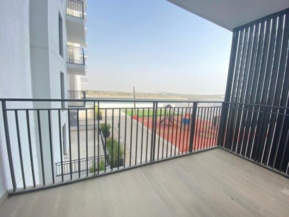 stunning-balcony-space-with-nice-view-of-the-sea-sky-and-the-kids-play-area-in-waters-edge-yas-island