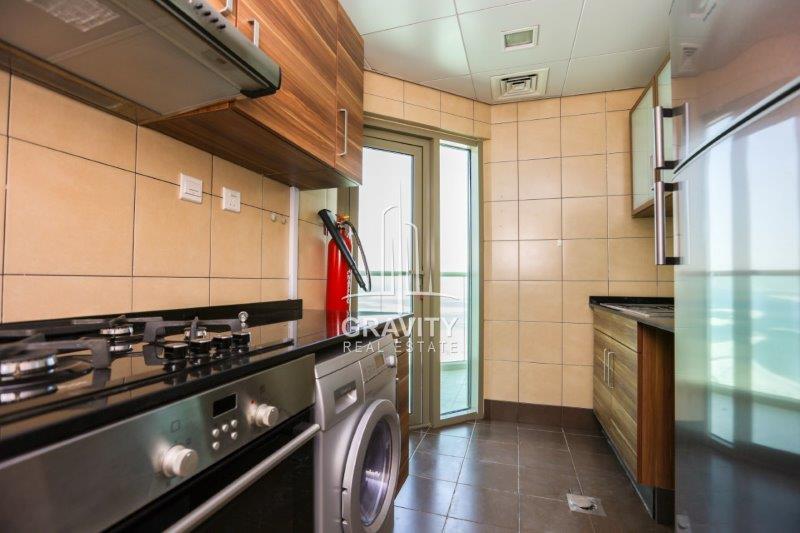 well-kept-kitchen-with-fire-extinguisher--in-beach-tower-reem-island