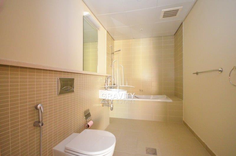 well-maintained-bathroom-equipped-with-bathtub-sink-vanity-mirror-toilet-in-al-raha-gardens-townhouse