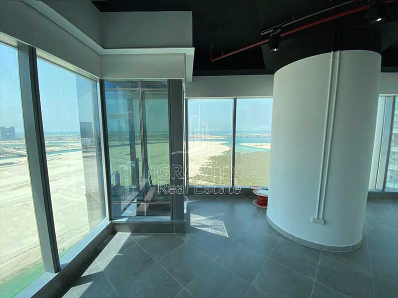 wide-open-area-with-large-white-pillar-in-office-in-addax-tower-reem-island