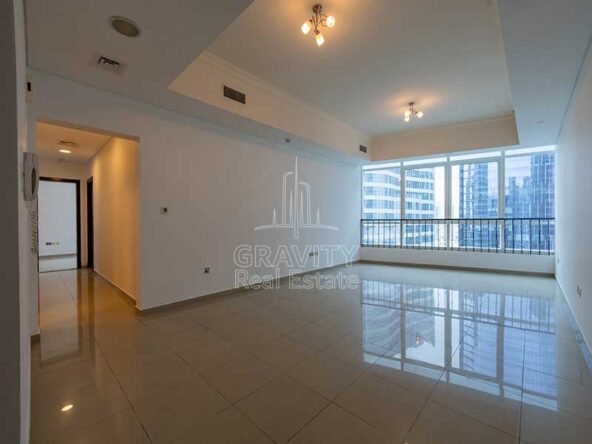 wide-open-living-room-with-blue-tinted-windows-in-excellent-2-bedroom-apartment-in-hydra-c6