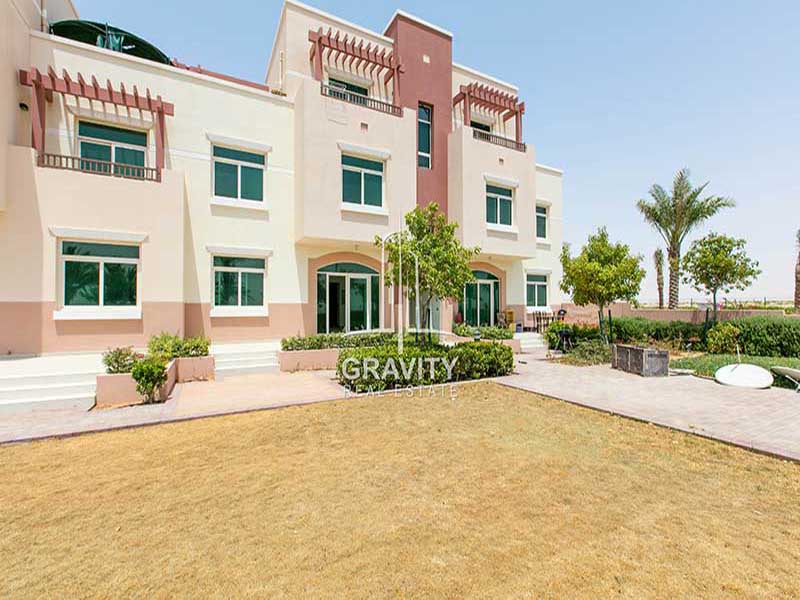 al-ghadeer-abu-dhabi-bulding-view-from-out-side-with-green-araes-on-the-side