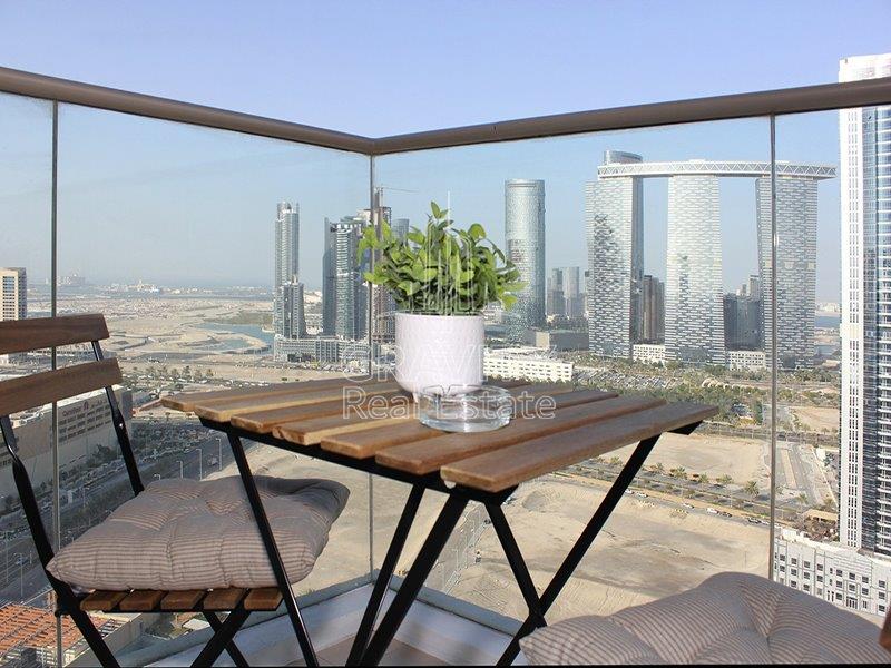 amazing-balcony-area-with-table-and-chairs-on-it-have-a-great-timne-the-wave-najamt