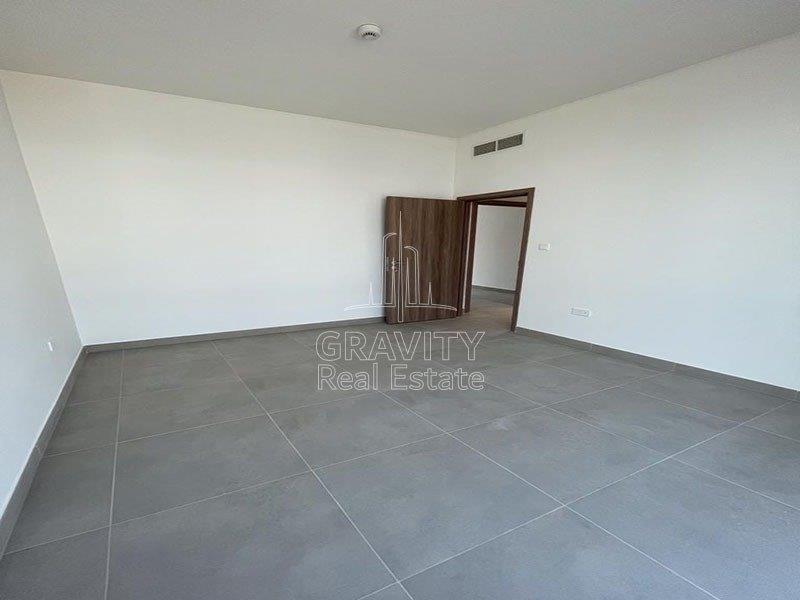 cozy-and-big-master-bedroom-of-a-2-bedroom-apartment-in-al-ghadeer-for-sale