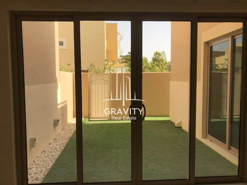 glass-door-w-a-view-of-the-backyard-of-a-3-bedroom-townhouse-in-sidra-community-raha-gardens-for-sale