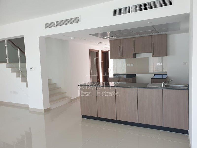 huge-living-hall-area-with-open-kitchen-and-stairs-for-the-second-floor-manazel-al-reef-2