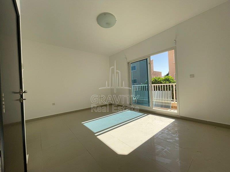 master-bedroom-w-glass-door-directed-to-balcony-of-a-2-bedroom-villa-in-al-reef-mediterranean-village-for-sale