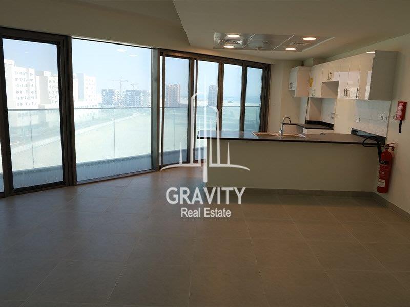 nice-and-cozy-living-room-w-open-kitchen-and-balcony-of-a-2bedroom-apartment-in-saadiyat-island-park-view