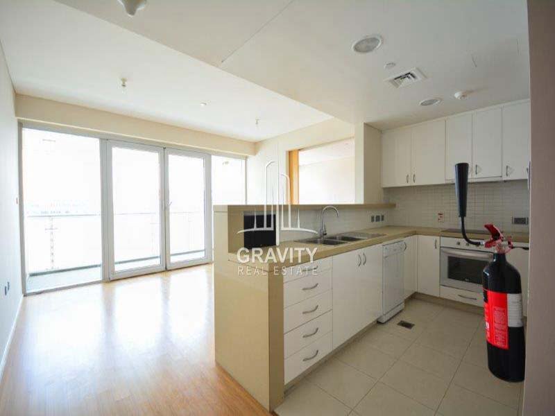 open-kitchen-in-a-1-bedroom-apartment-in-al-maha-al-raha-beach-for-sale