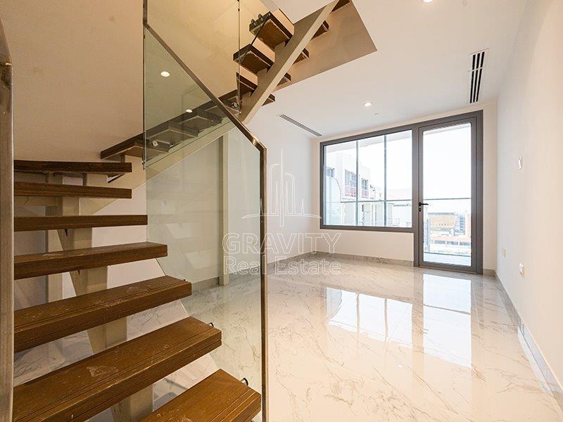 shiny-hall-area-and-the-nicely-made-staircase-that-leads-to-the-second-floor-in-oasis-1-masdar-city